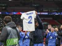 Tasos Bakasetas holds an official jersey with the name BALDOCK while he appears emotional. The Greek team heads to the Greek fans to celebra...