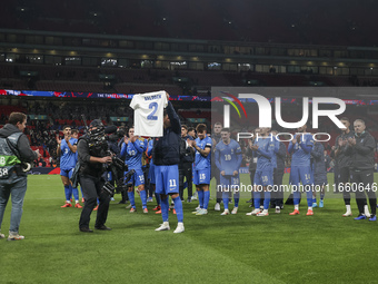 Tasos Bakasetas holds an official jersey with the name BALDOCK while he appears emotional. The Greek team heads to the Greek fans to celebra...