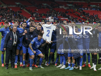 The Greek team stands in front of the side with the Greek fans, celebrating and thanking them. They dedicate their win to their late teammat...