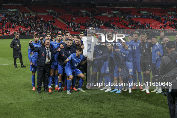 The Greek team stands in front of the side with the Greek fans, celebrating and thanking them. They dedicate their win to their late teammat...