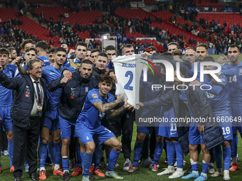 The Greek team stands in front of the side with the Greek fans, celebrating and thanking them. They dedicate their win to their late teammat...