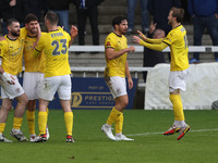 George Carline of Brackley Town celebrates with his teammates after scoring their first goal during the FA Cup Fourth Qualifying Round match...