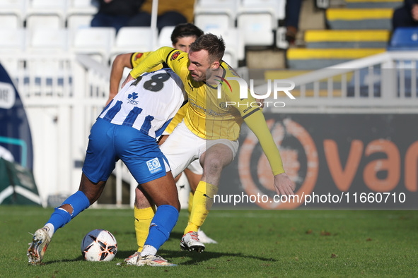 Roshaun Mathurin of Hartlepool United battles for possession with Shane Byrne of Brackley Town during the FA Cup Fourth Qualifying Round mat...