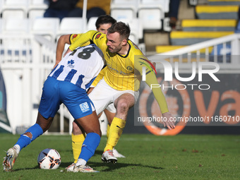 Roshaun Mathurin of Hartlepool United battles for possession with Shane Byrne of Brackley Town during the FA Cup Fourth Qualifying Round mat...