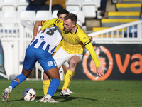 Roshaun Mathurin of Hartlepool United battles for possession with Shane Byrne of Brackley Town during the FA Cup Fourth Qualifying Round mat...