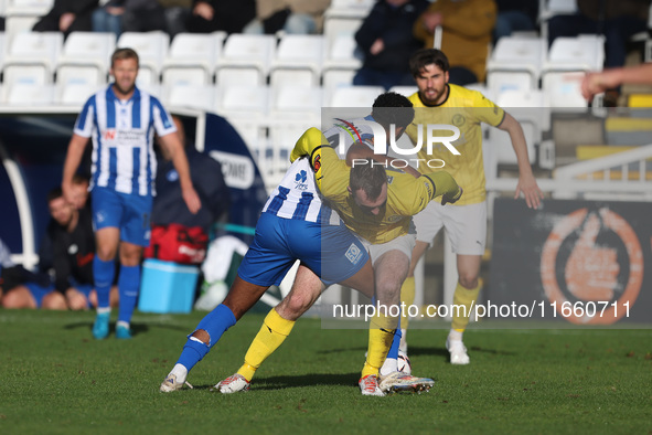 Roshaun Mathurin of Hartlepool United battles for possession with Shane Byrne of Brackley Town during the FA Cup Fourth Qualifying Round mat...