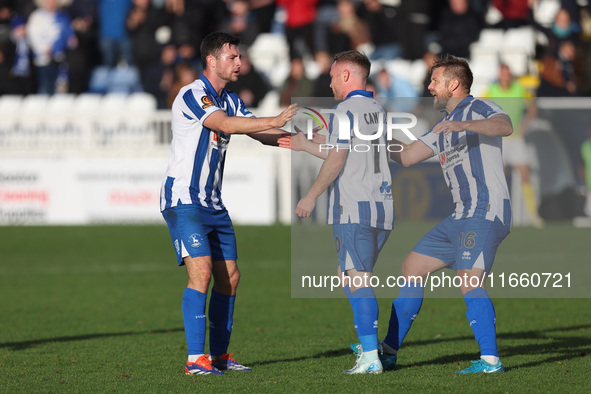 Adam Campbell of Hartlepool United celebrates with his teammates Nathan Sheron and Nicky Featherstone after scoring to level the score at 1-...