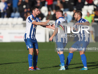 Adam Campbell of Hartlepool United celebrates with his teammates Nathan Sheron and Nicky Featherstone after scoring to level the score at 1-...