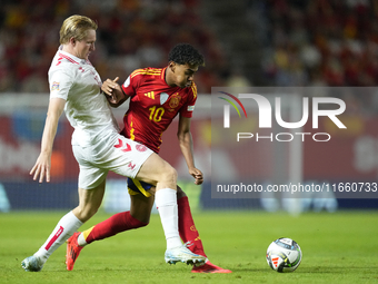 Lamine Yamal right winger of Spain and FC Barcelona and Pierre-Emile Hojbjerg defensive midfield of Denmark and Olympique Marseille compete...