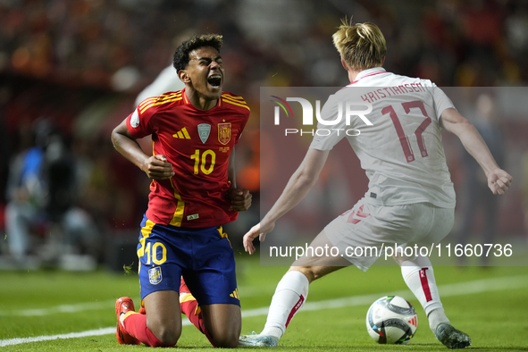 Lamine Yamal right winger of Spain and FC Barcelona and Victor Kristiansen left-back of Denmark and Leicester City compete for the ball duri...