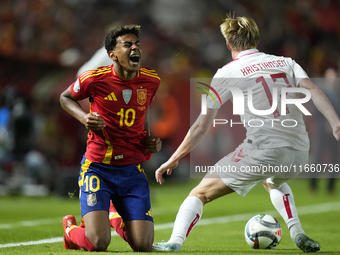 Lamine Yamal right winger of Spain and FC Barcelona and Victor Kristiansen left-back of Denmark and Leicester City compete for the ball duri...