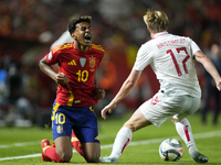 Lamine Yamal right winger of Spain and FC Barcelona and Victor Kristiansen left-back of Denmark and Leicester City compete for the ball duri...