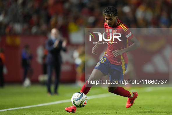 Lamine Yamal right winger of Spain and FC Barcelona controls the ball during the UEFA Nations League 2024/25 League A Group A4 match between...