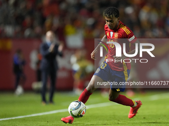 Lamine Yamal right winger of Spain and FC Barcelona controls the ball during the UEFA Nations League 2024/25 League A Group A4 match between...