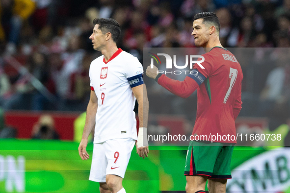 Cristiano Ronaldo reacts after scoring a goal while Robert Lewandowski looks on during the UEFA 2024 UEFA Nations League Group A1 match betw...