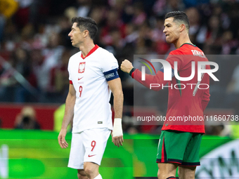 Cristiano Ronaldo reacts after scoring a goal while Robert Lewandowski looks on during the UEFA 2024 UEFA Nations League Group A1 match betw...