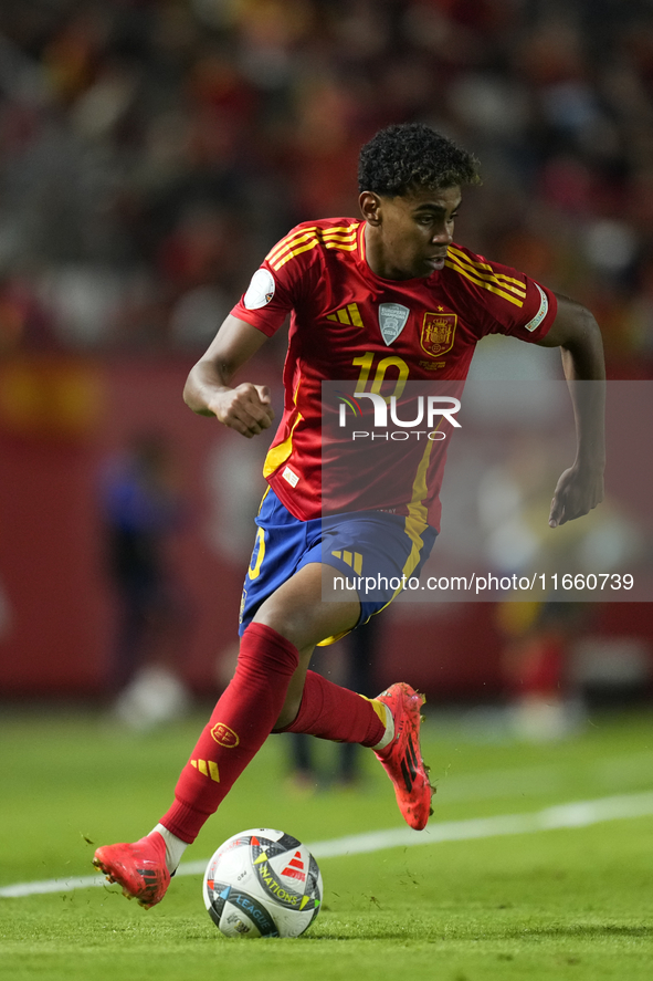 Lamine Yamal right winger of Spain and FC Barcelona controls the ball during the UEFA Nations League 2024/25 League A Group A4 match between...