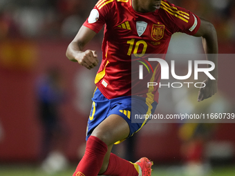 Lamine Yamal right winger of Spain and FC Barcelona controls the ball during the UEFA Nations League 2024/25 League A Group A4 match between...