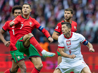 Cristiano Ronaldo and Robert Lewandowski are playing  during the  UEFA Nations League 2024 League A Group A1 match between Poland and Portug...