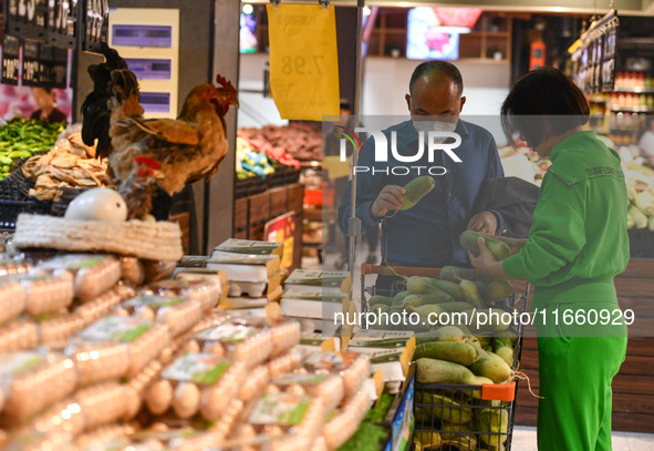 Citizens shop at a supermarket in Fuyang, China, on October 13, 2024. On the same day, the National Bureau of Statistics releases data showi...