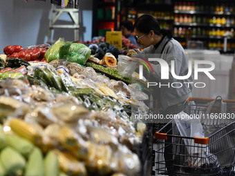 Citizens shop at a supermarket in Fuyang, China, on October 13, 2024. On the same day, the National Bureau of Statistics releases data showi...