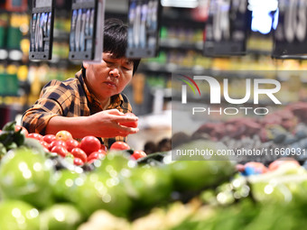 Citizens shop at a supermarket in Fuyang, China, on October 13, 2024. On the same day, the National Bureau of Statistics releases data showi...