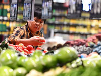 Citizens shop at a supermarket in Fuyang, China, on October 13, 2024. On the same day, the National Bureau of Statistics releases data showi...