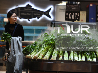 Citizens shop at a supermarket in Fuyang, China, on October 13, 2024. On the same day, the National Bureau of Statistics releases data showi...