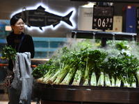 Citizens shop at a supermarket in Fuyang, China, on October 13, 2024. On the same day, the National Bureau of Statistics releases data showi...