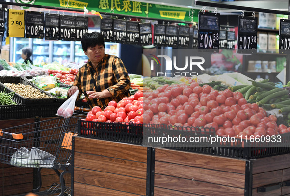 Citizens shop at a supermarket in Fuyang, China, on October 13, 2024. On the same day, the National Bureau of Statistics releases data showi...