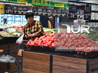 Citizens shop at a supermarket in Fuyang, China, on October 13, 2024. On the same day, the National Bureau of Statistics releases data showi...