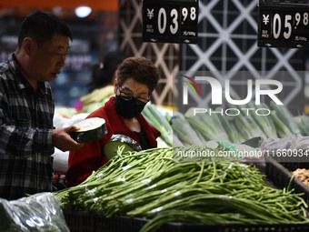 Citizens shop at a supermarket in Fuyang, China, on October 13, 2024. On the same day, the National Bureau of Statistics releases data showi...