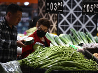 Citizens shop at a supermarket in Fuyang, China, on October 13, 2024. On the same day, the National Bureau of Statistics releases data showi...