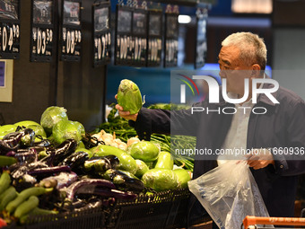 Citizens shop at a supermarket in Fuyang, China, on October 13, 2024. On the same day, the National Bureau of Statistics releases data showi...