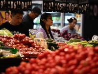 Citizens shop at a supermarket in Fuyang, China, on October 13, 2024. On the same day, the National Bureau of Statistics releases data showi...