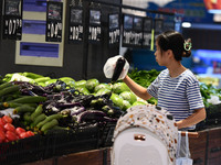 Citizens shop at a supermarket in Fuyang, China, on October 13, 2024. On the same day, the National Bureau of Statistics releases data showi...