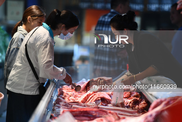 Citizens shop at a supermarket in Fuyang, China, on October 13, 2024. On the same day, the National Bureau of Statistics releases data showi...