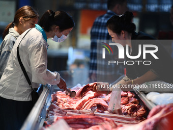 Citizens shop at a supermarket in Fuyang, China, on October 13, 2024. On the same day, the National Bureau of Statistics releases data showi...