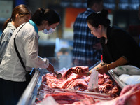 Citizens shop at a supermarket in Fuyang, China, on October 13, 2024. On the same day, the National Bureau of Statistics releases data showi...