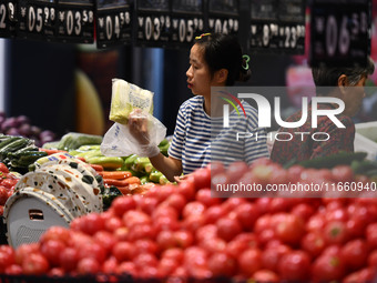 Citizens shop at a supermarket in Fuyang, China, on October 13, 2024. On the same day, the National Bureau of Statistics releases data showi...