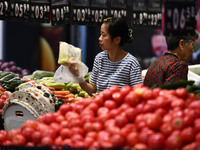 Citizens shop at a supermarket in Fuyang, China, on October 13, 2024. On the same day, the National Bureau of Statistics releases data showi...