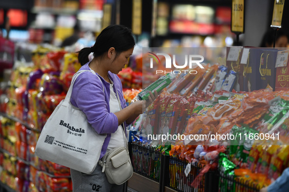 Citizens shop at a supermarket in Fuyang, China, on October 13, 2024. On the same day, the National Bureau of Statistics releases data showi...