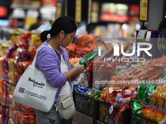 Citizens shop at a supermarket in Fuyang, China, on October 13, 2024. On the same day, the National Bureau of Statistics releases data showi...