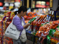 Citizens shop at a supermarket in Fuyang, China, on October 13, 2024. On the same day, the National Bureau of Statistics releases data showi...