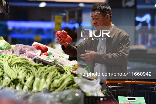 Citizens shop at a supermarket in Fuyang, China, on October 13, 2024. On the same day, the National Bureau of Statistics releases data showi...