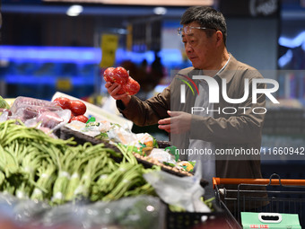 Citizens shop at a supermarket in Fuyang, China, on October 13, 2024. On the same day, the National Bureau of Statistics releases data showi...