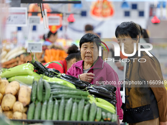 Citizens shop at a supermarket in Zaozhuang, China, on October 13, 2024. On the same day, the National Bureau of Statistics releases data sh...