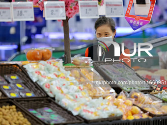 Citizens shop at a supermarket in Zaozhuang, China, on October 13, 2024. On the same day, the National Bureau of Statistics releases data sh...