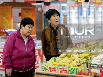 Citizens shop at a supermarket in Zaozhuang, China, on October 13, 2024. On the same day, the National Bureau of Statistics releases data sh...