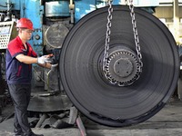 Workers work at a stainless steel material processing enterprise in Qingzhou, China, on October 13, 2024. (